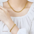 Conjunto Gabriela, aço inoxidável, dourado, formato  trigo, colar e pulseira.
