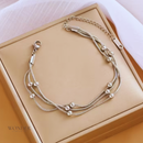 Pulseira Bruna, de aço inoxidável, prata, corrente enrolada.