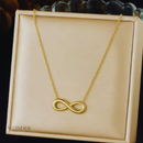 Colar Berlinda, aço inoxidável, dourado, com símbolo infinito.