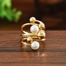 Anel Brigida, dourado e peróla, esfera.