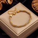 Pulseira Alma, aço inoxidável, prata e dourado.