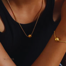 Conjunto Francisca, aço inoxidável, cor de ouro, grânulo bola, colar e pulseira.