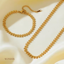 Conjunto Gabriela, aço inoxidável, dourado, formato  trigo, colar e pulseira.