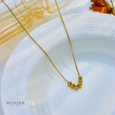 Colar Paty, aço inoxidável, dourado, pingente de bolas.