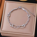 Pulseira Bruna, de aço inoxidável, prata, corrente enrolada.
