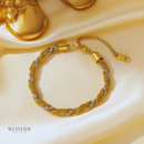 Pulseira Alma, aço inoxidável, prata e dourado.