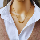Colar Paty, aço inoxidável, dourado, pingente de bolas.
