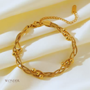 Pulseira Bruna, de aço inoxidável, dourada, corrente enrolada.